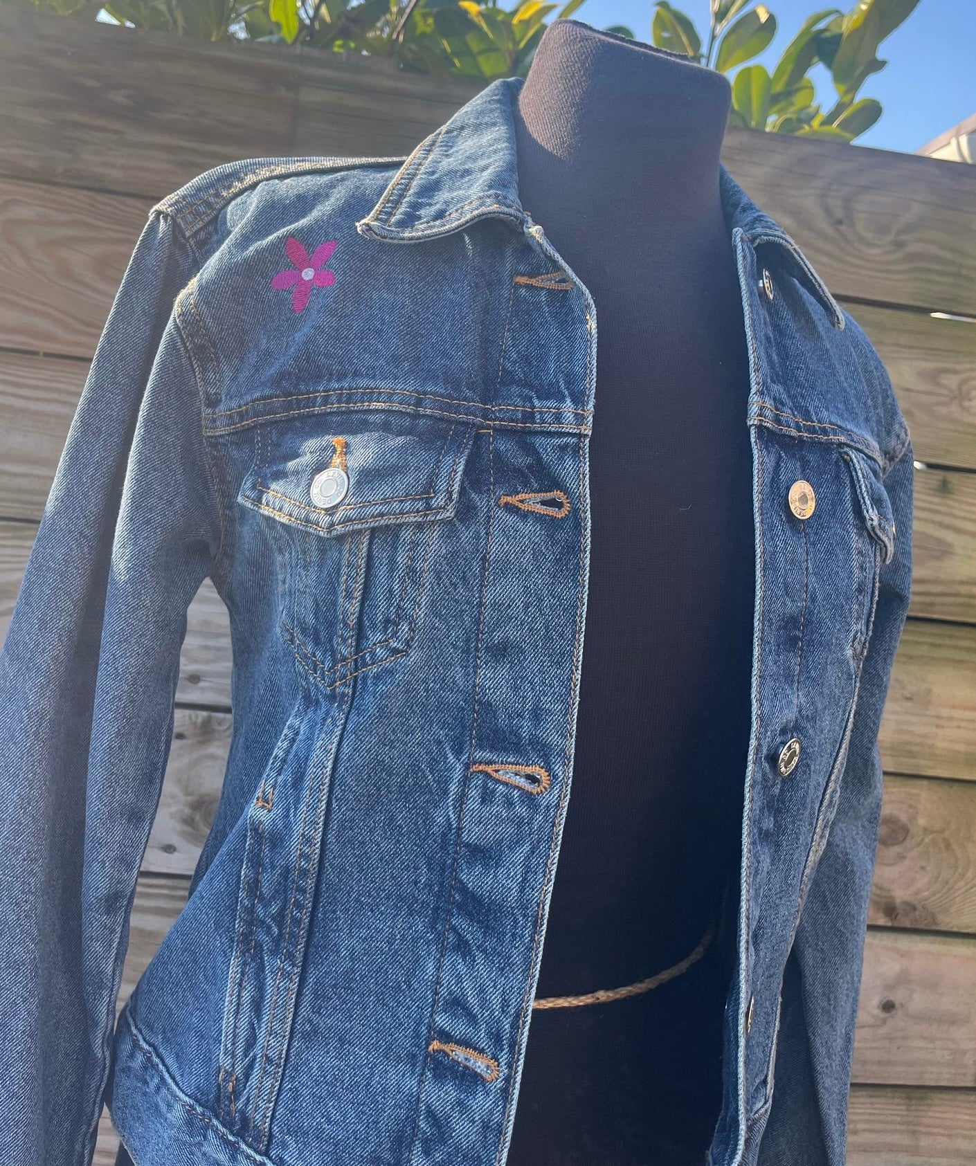 Ladies Denim Jacket with an embroidered Highland Cow and Scattered Flowers