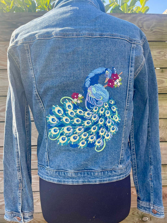 Ladies Denim Jacket featuring an embroidered Peacock